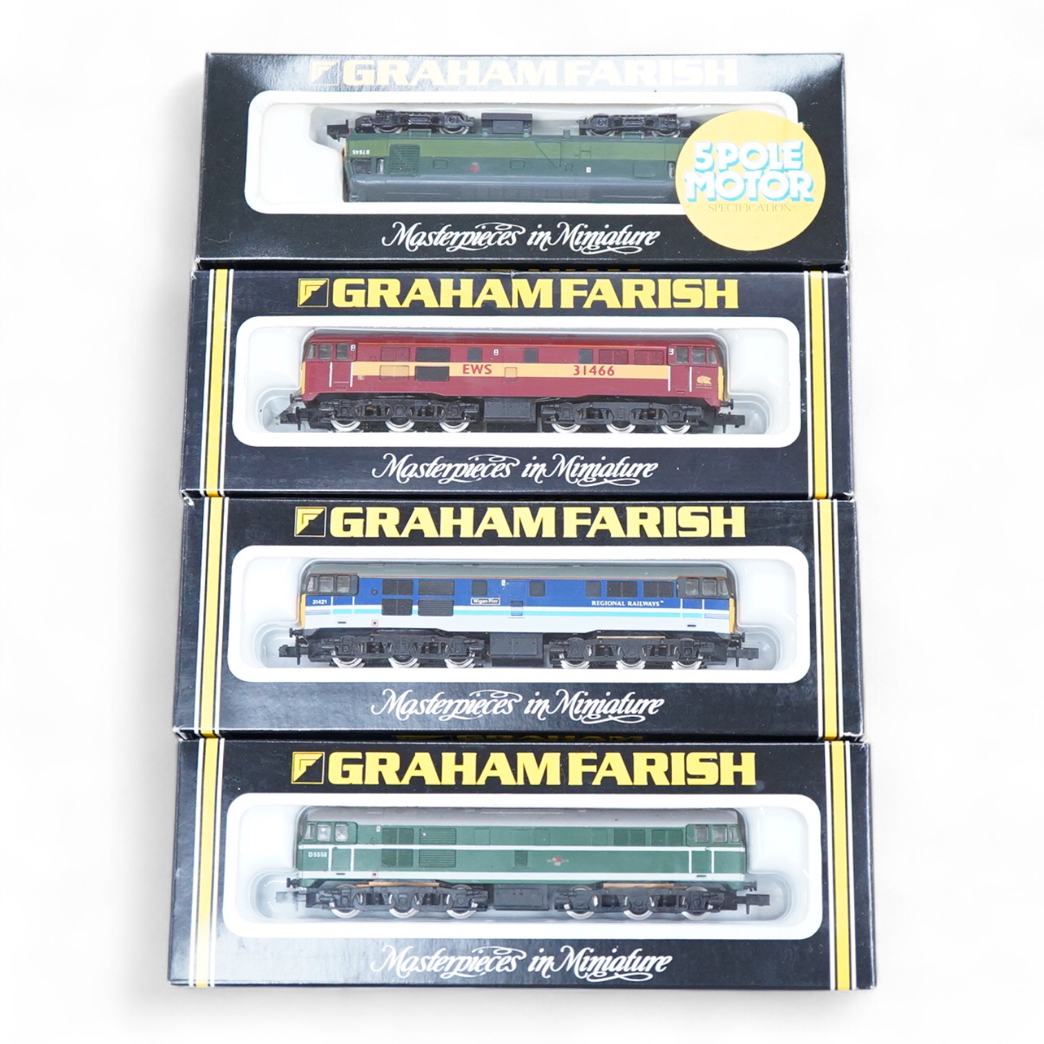 Four boxed Graham Farish N gauge railway diesel locomotives; a BR class 31, D5558 (8064), a Regional Railways class 31, Wigan Pier 31421 (8067), an EWS class 31, 31466, (806B) and a BR class 25, D7645 (8304).